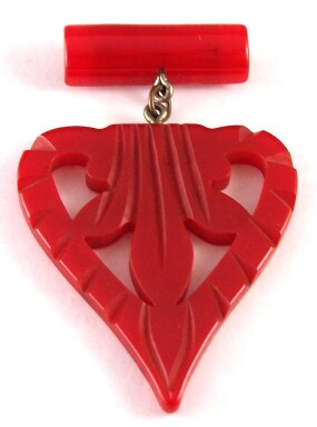 BP95 carved red bakelite heart pin